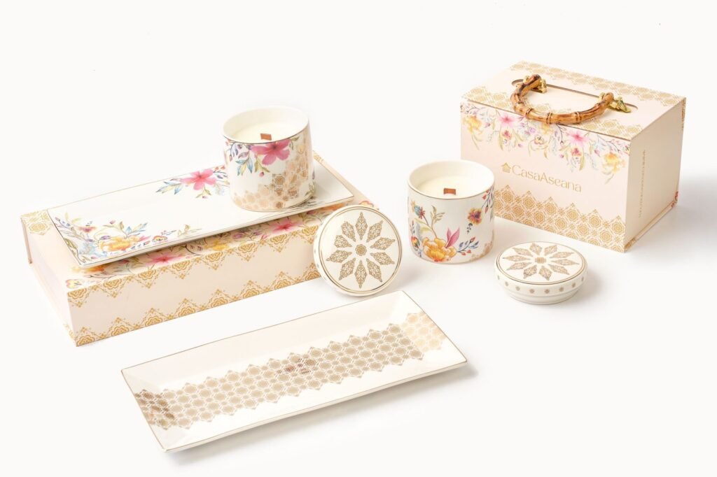 Casa Aseana Porcelain Candle beside Casa Aseana gift boxes