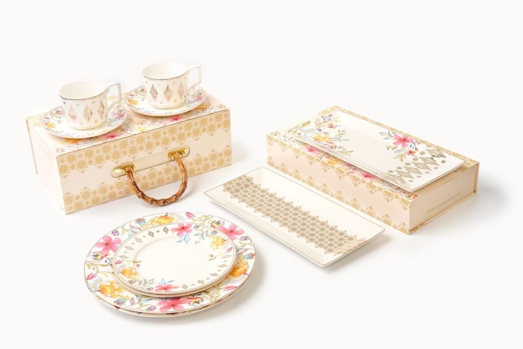 Casa Aseana porcelain dining plates with the bunga raya, displayed with gift boxes