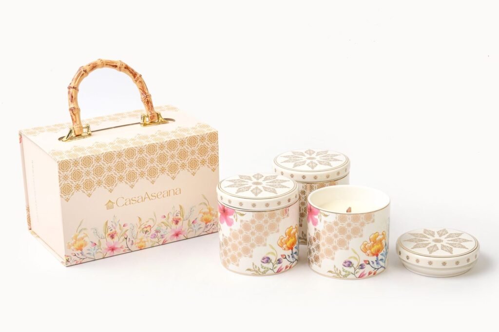 Casa Aseana candle jars beside a Casa Aseana gift box with bamboo handle