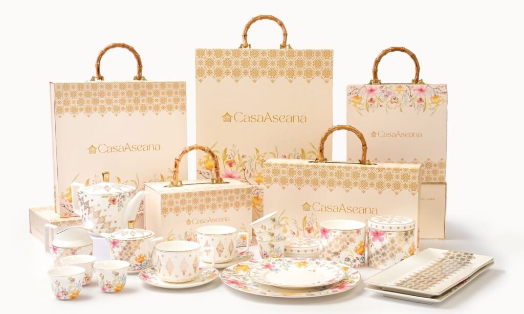 Casa Aseana gift boxes with bamboo handles behind the Royal Songket Collection in fine porcelain