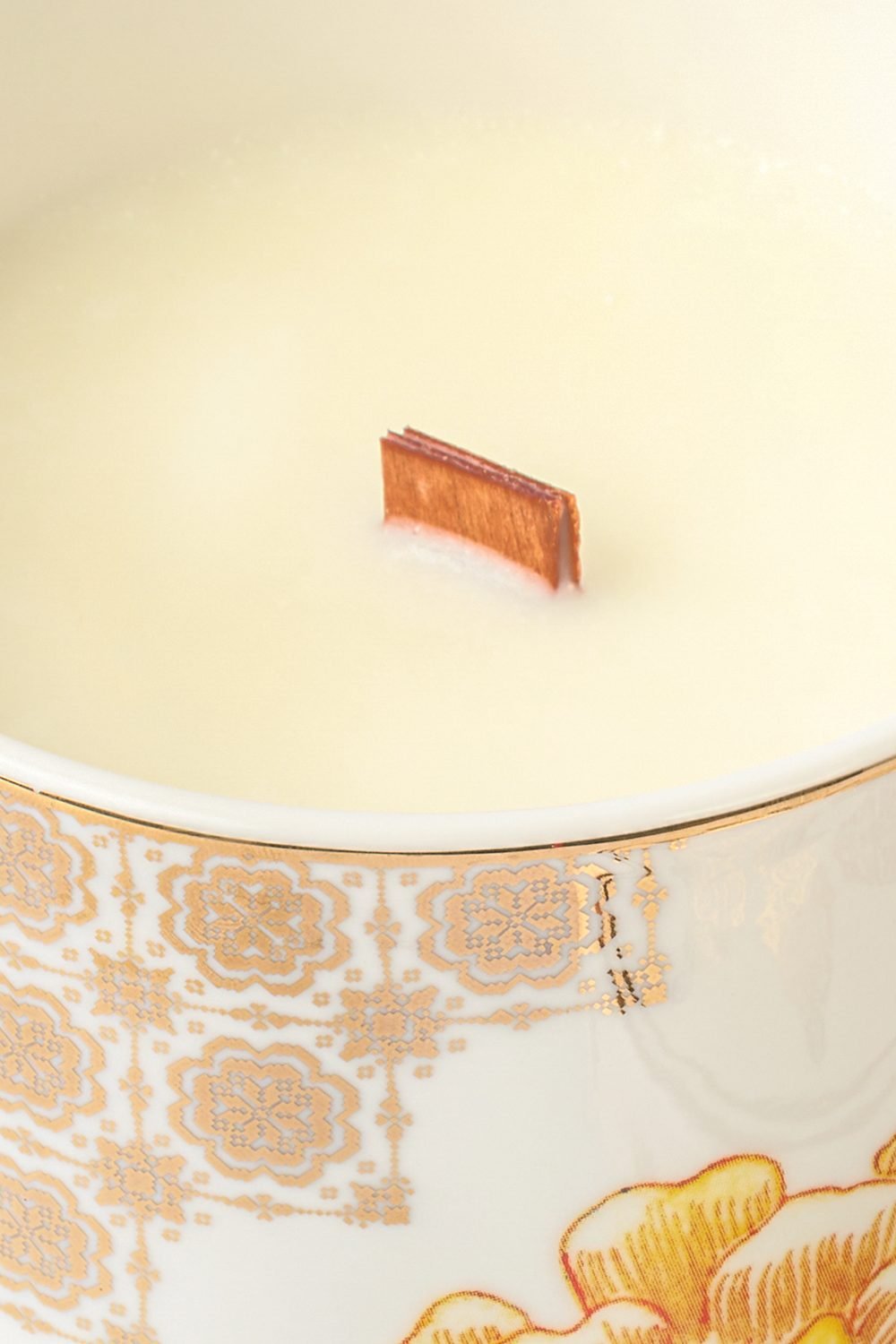 Close-up of the candle wax and wooden wick in a Casa Aseana Porcelain Candle