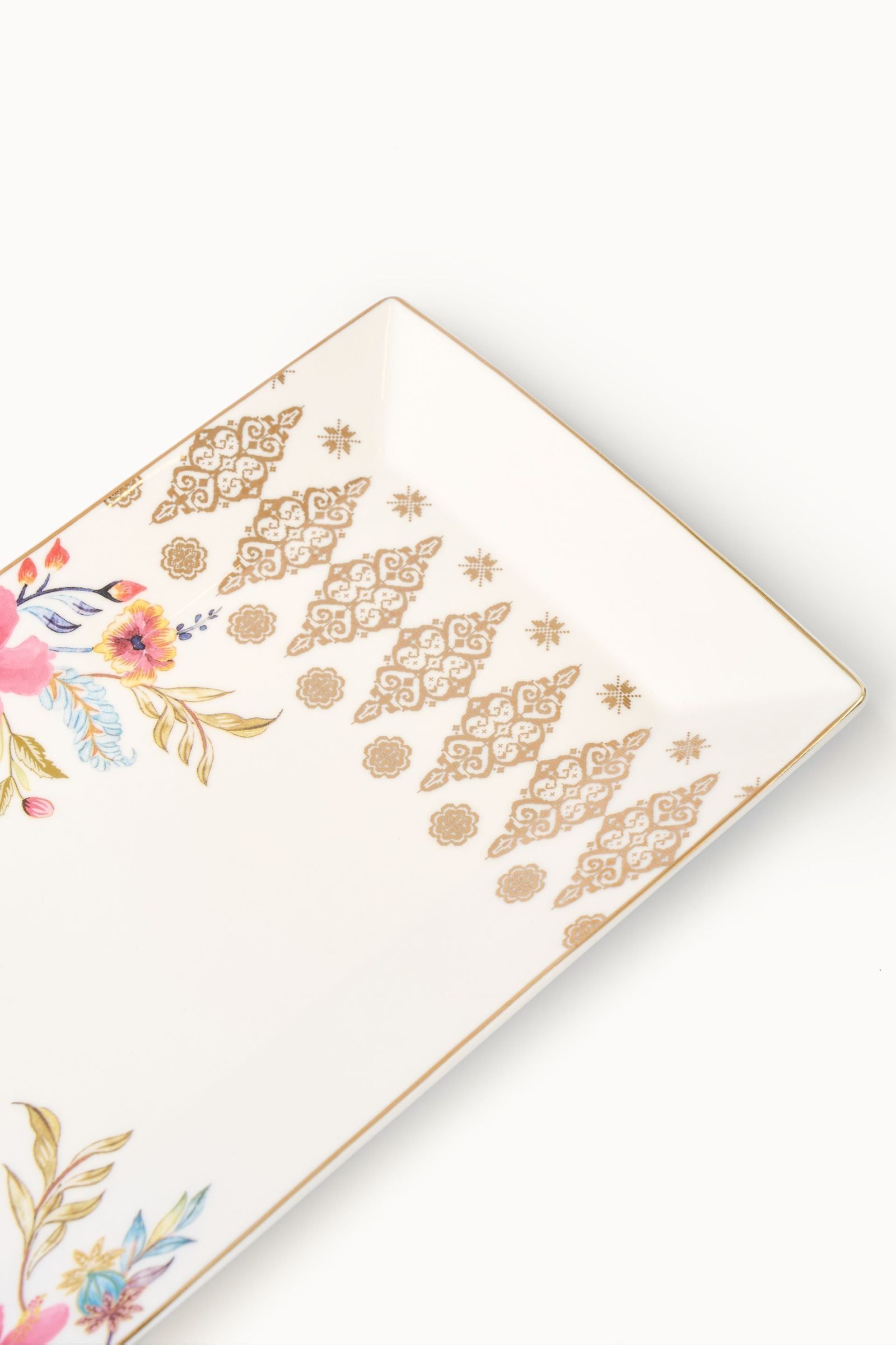 Close-up of the gold songket motif on the Casa Aseana Serving Plate, Bunga Raya