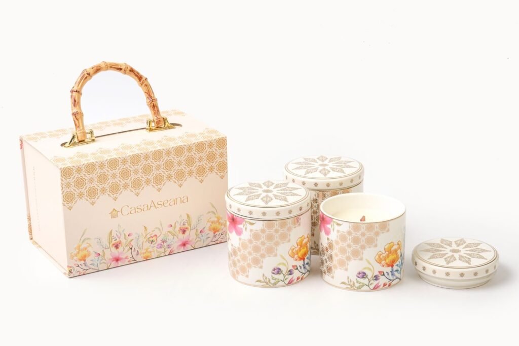 Casa Aseana candle jars beside a Casa Aseana gift box with bamboo handle