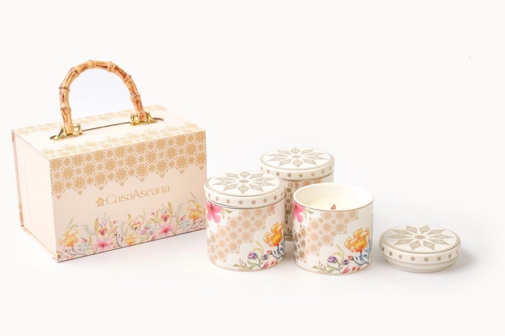 Casa Aseana Porcelain Candles from The Royal Songket Collection beside their gift box with a bamboo handle