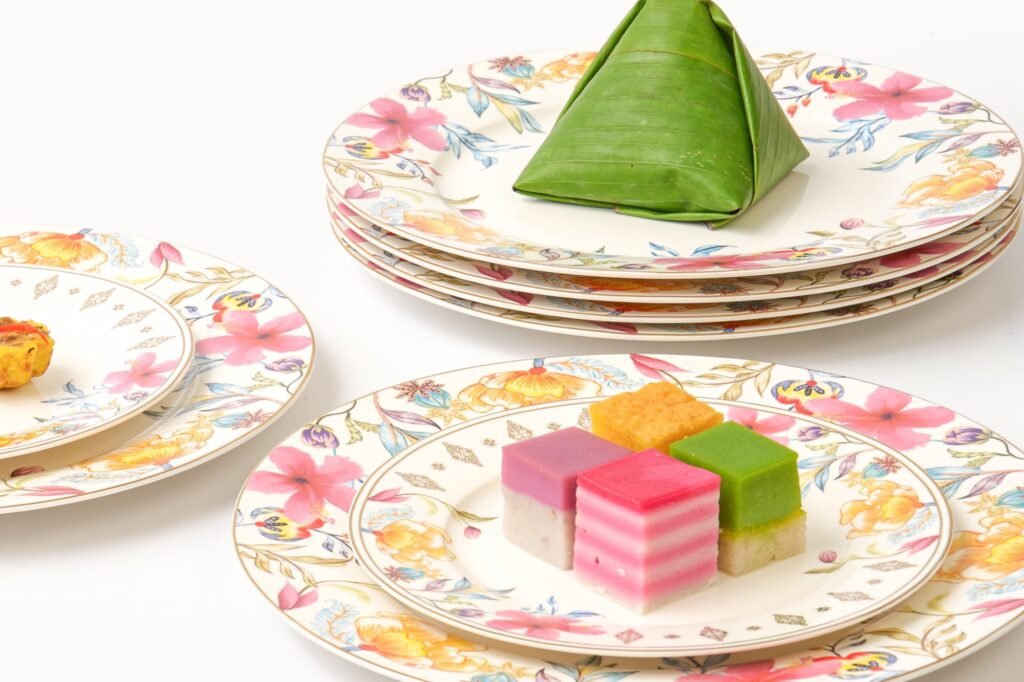 Casa Aseana Dining and Dessert Plate Sets from The Royal Songket Collection, laid with kuih