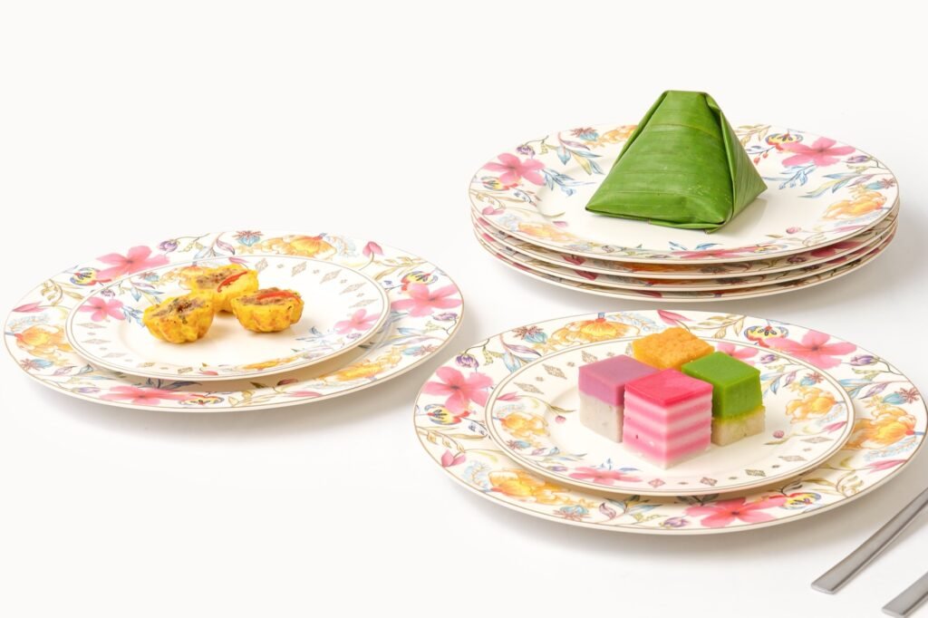 Casa Aseana Dining and Dessert Plate Sets from The Royal Songket Collection, laid with kuih